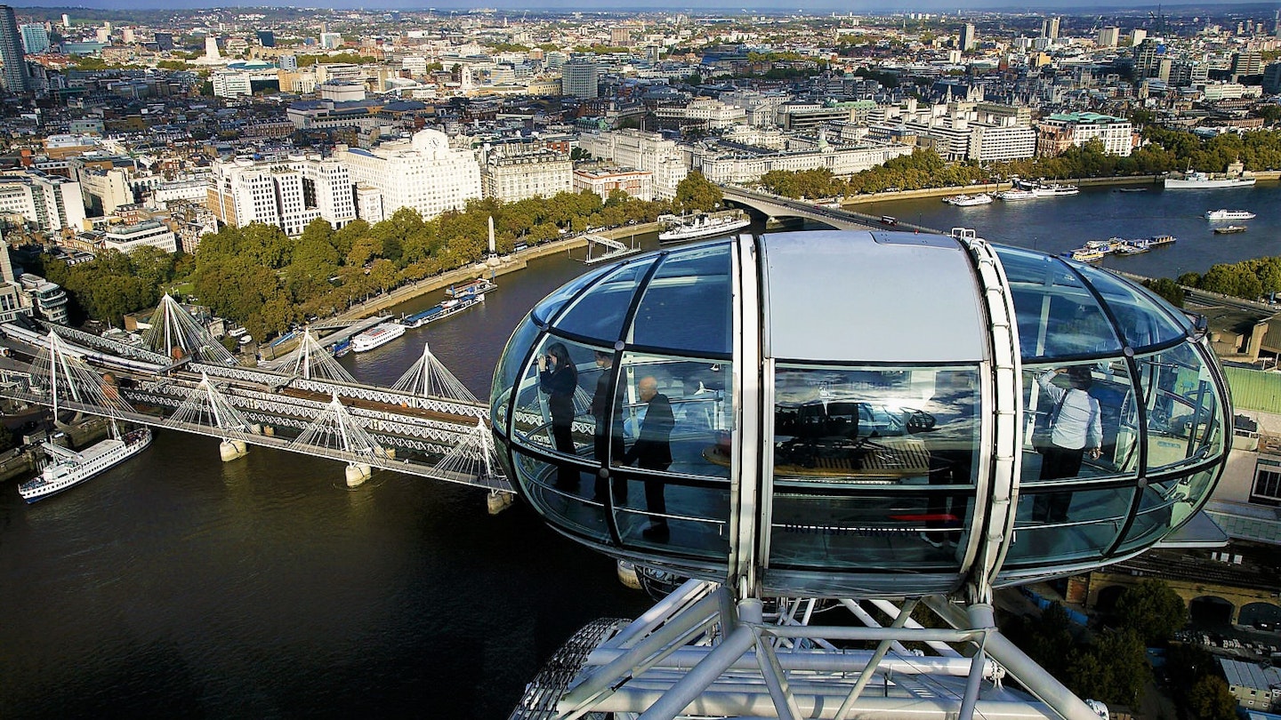 Capsule on the London Eye rises above the Thames