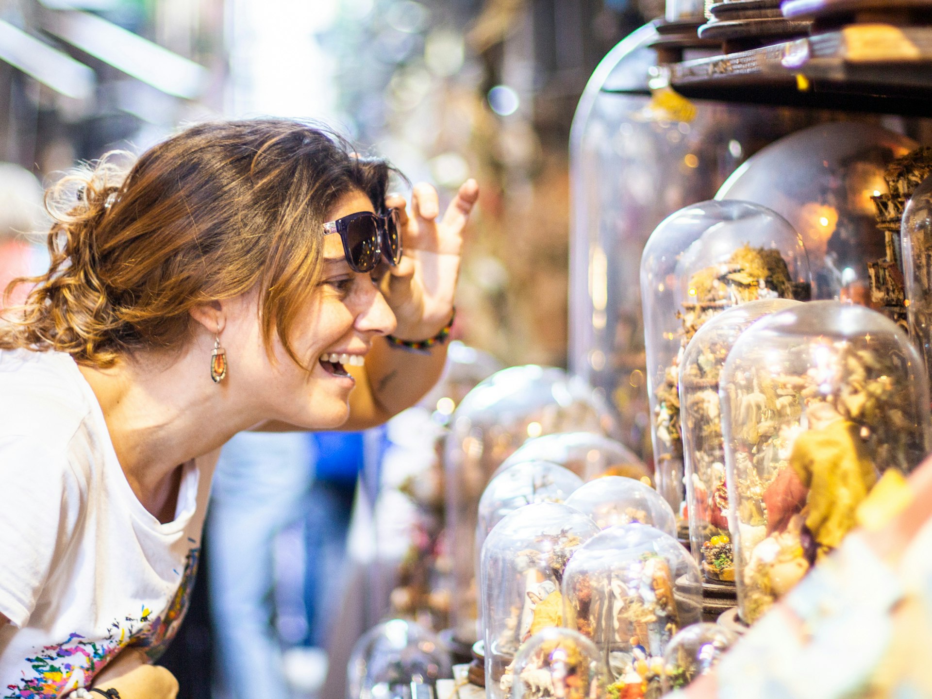 A woman browsing a market stall in Naples 