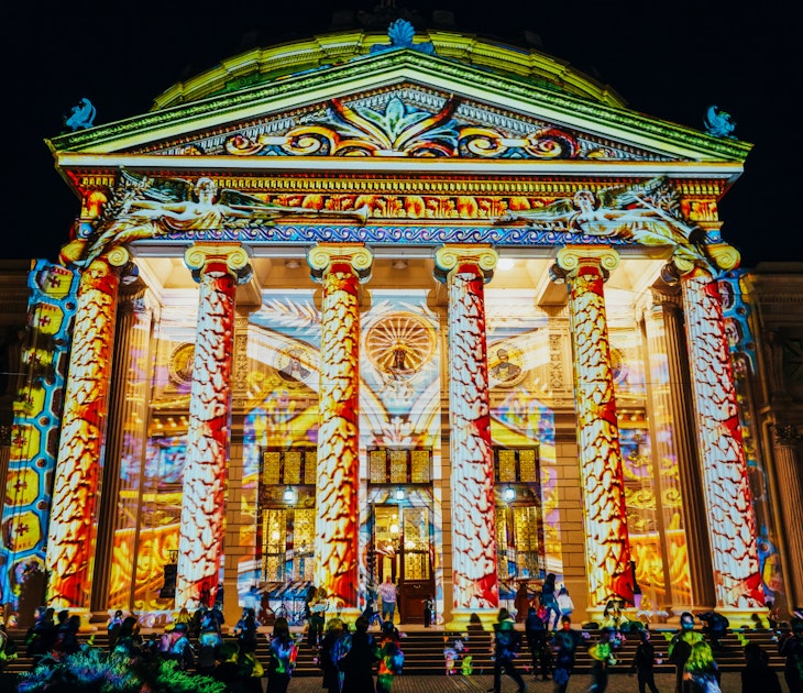Romanian Athenaeum beautifully lit up at night during the Spotlight Bucharest International Light Festival © Radu Bercan / Shutterstock