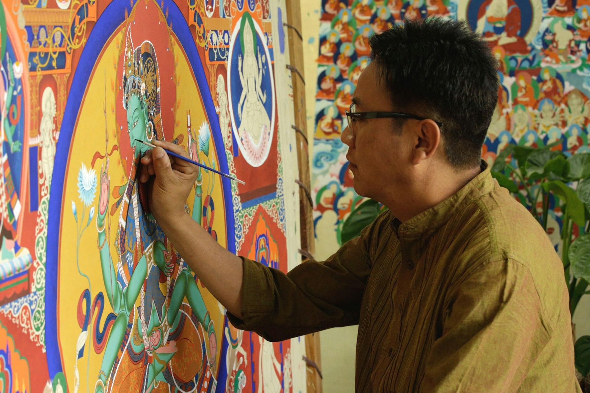 Painter working on a Buddhist thangka