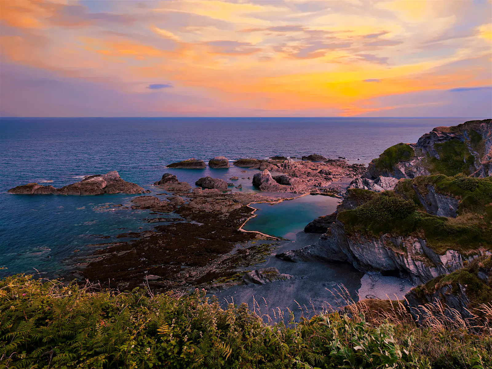 Features - Tunnels_beach_Devon-5252ad57420c A sunset over the rocks pools of Tunnels Beaches in Devon