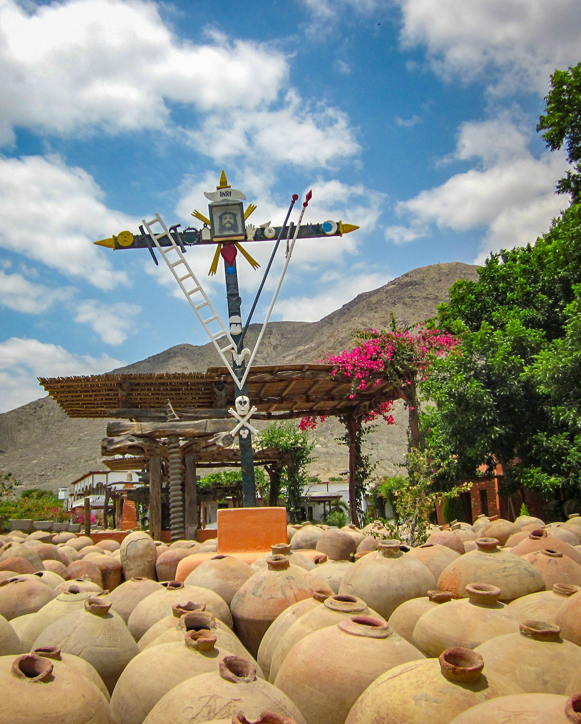 Dozens of traditional pisco vessels sit side by side at a pisco vineyard in the Ica Valley of Peru