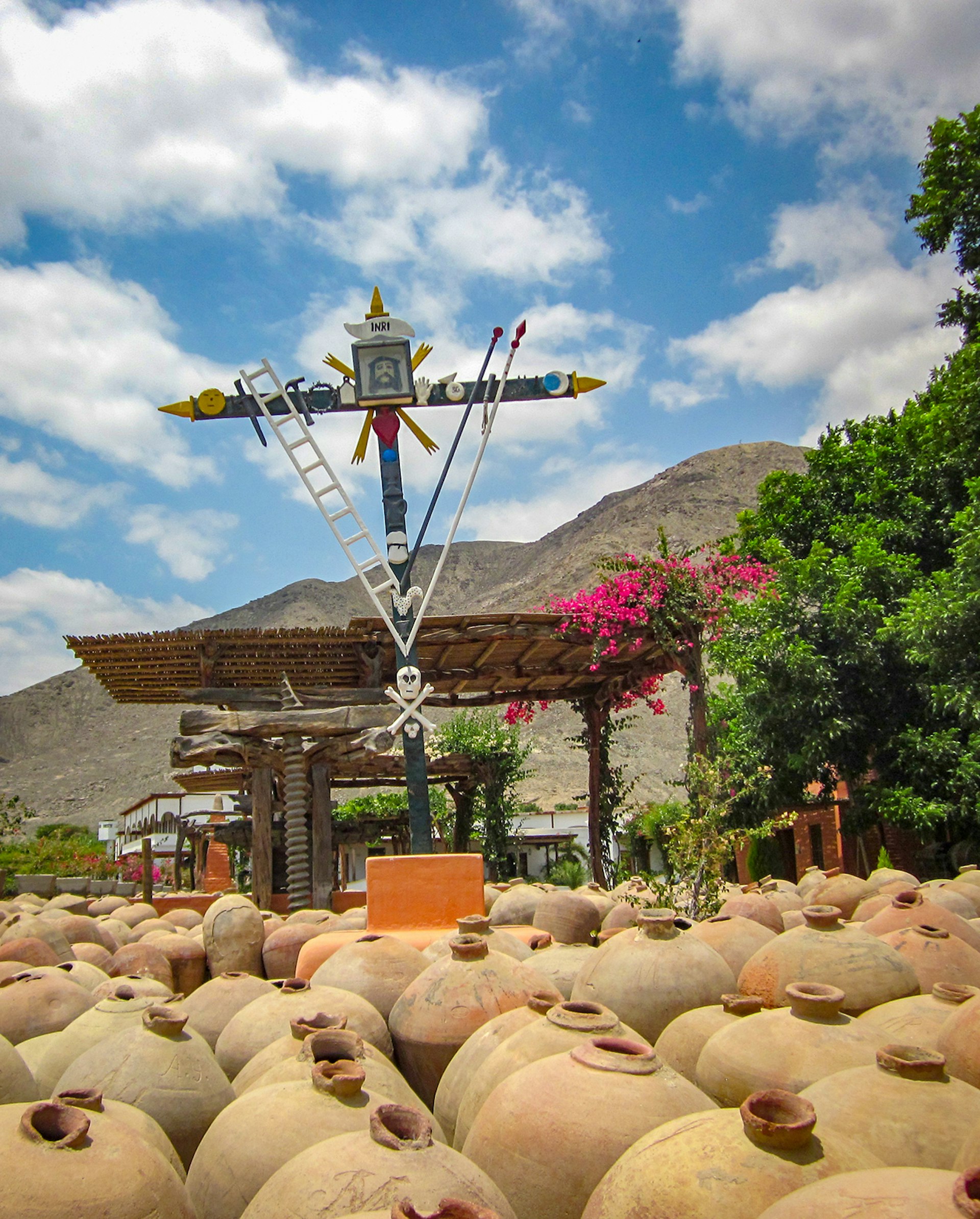 Dozens of traditional pisco vessels sit side by side at a pisco vineyard in the Ica Valley of Peru