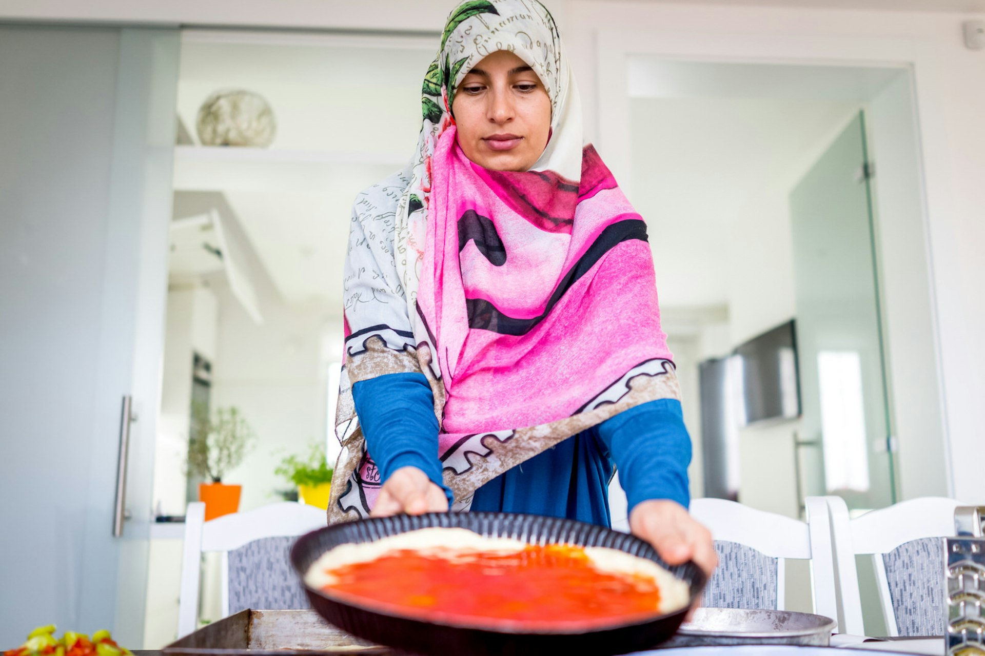 Muslim woman makes food during Ramadan