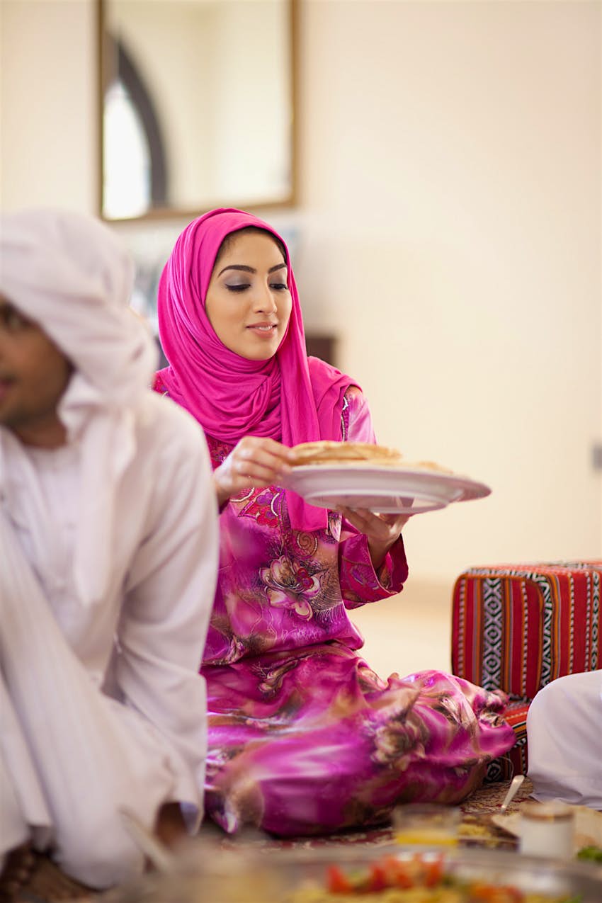 A Middle Eastern family breaks the fast with the meal called iftar during Ramadan
