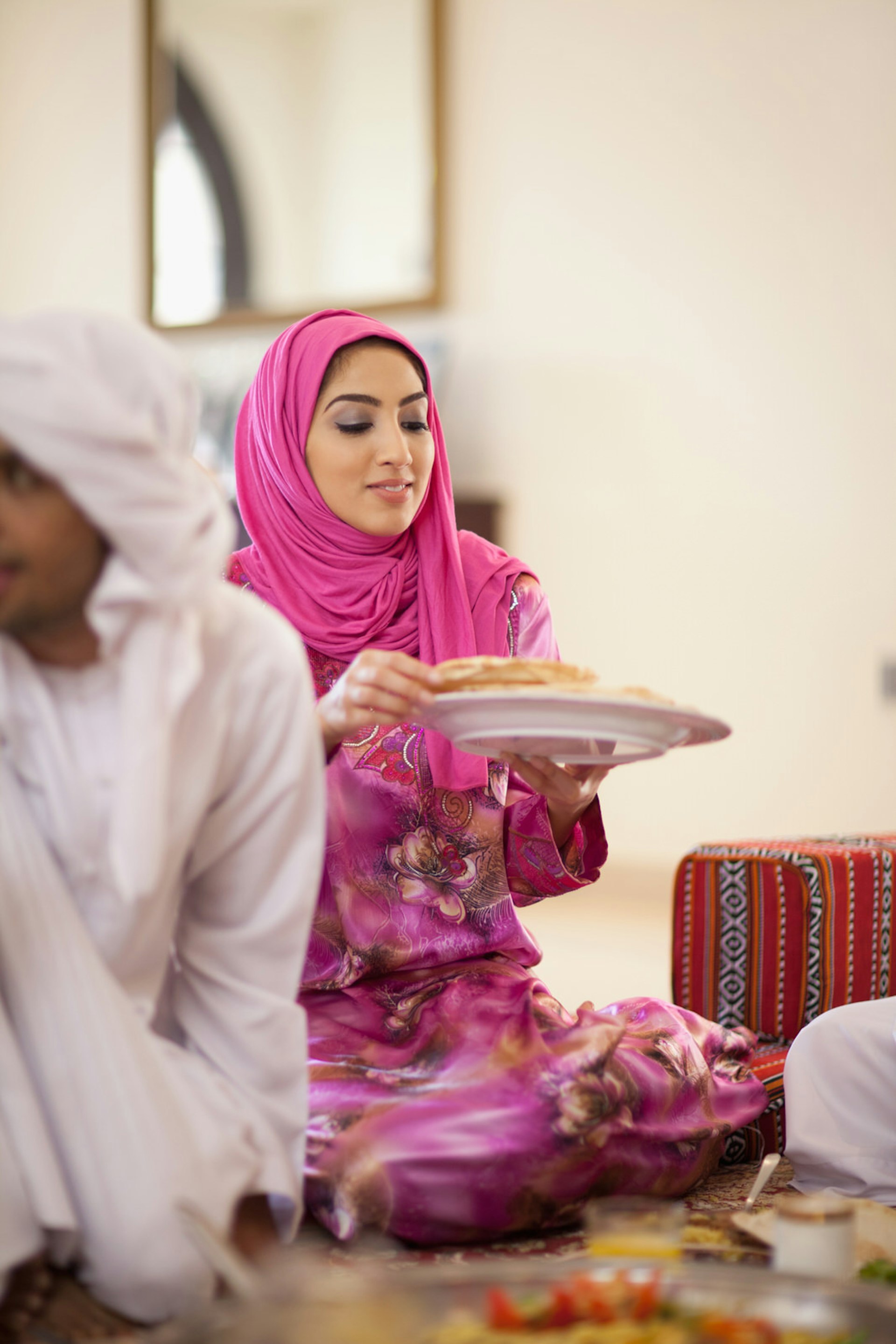 A Middle Eastern family breaks the fast with the meal called iftar during Ramadan