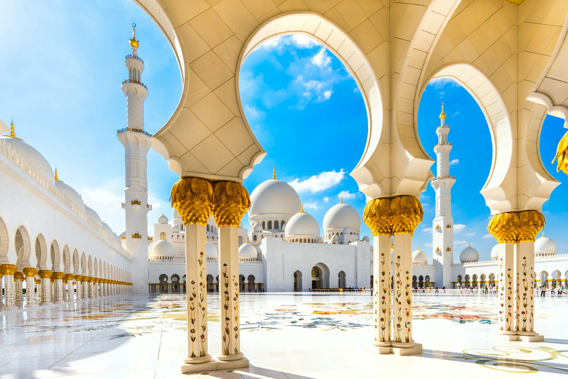 The beautifully decorated arches and interior courtyard at Sheikh Zayed Mosque, Abu Dhabi, United Arab Emirates