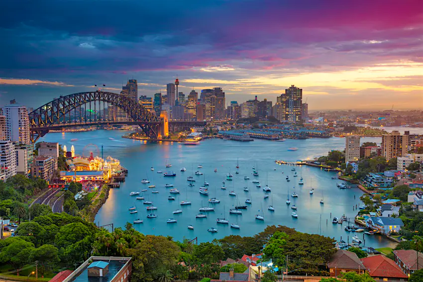 Sydney Harbour Cityscape image of Sydney, Australia with Harbour Bridge and Sydney skyline during sunset