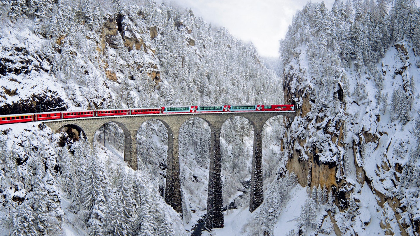 The Landwasser Viaduct with a Glacier Express train running over the top of it