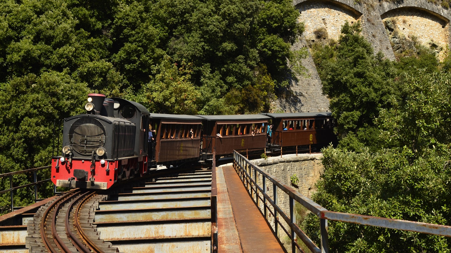 The heritage tourist train crossing a bridge in the mountains of Pelion © fritz16 / Shutterstock