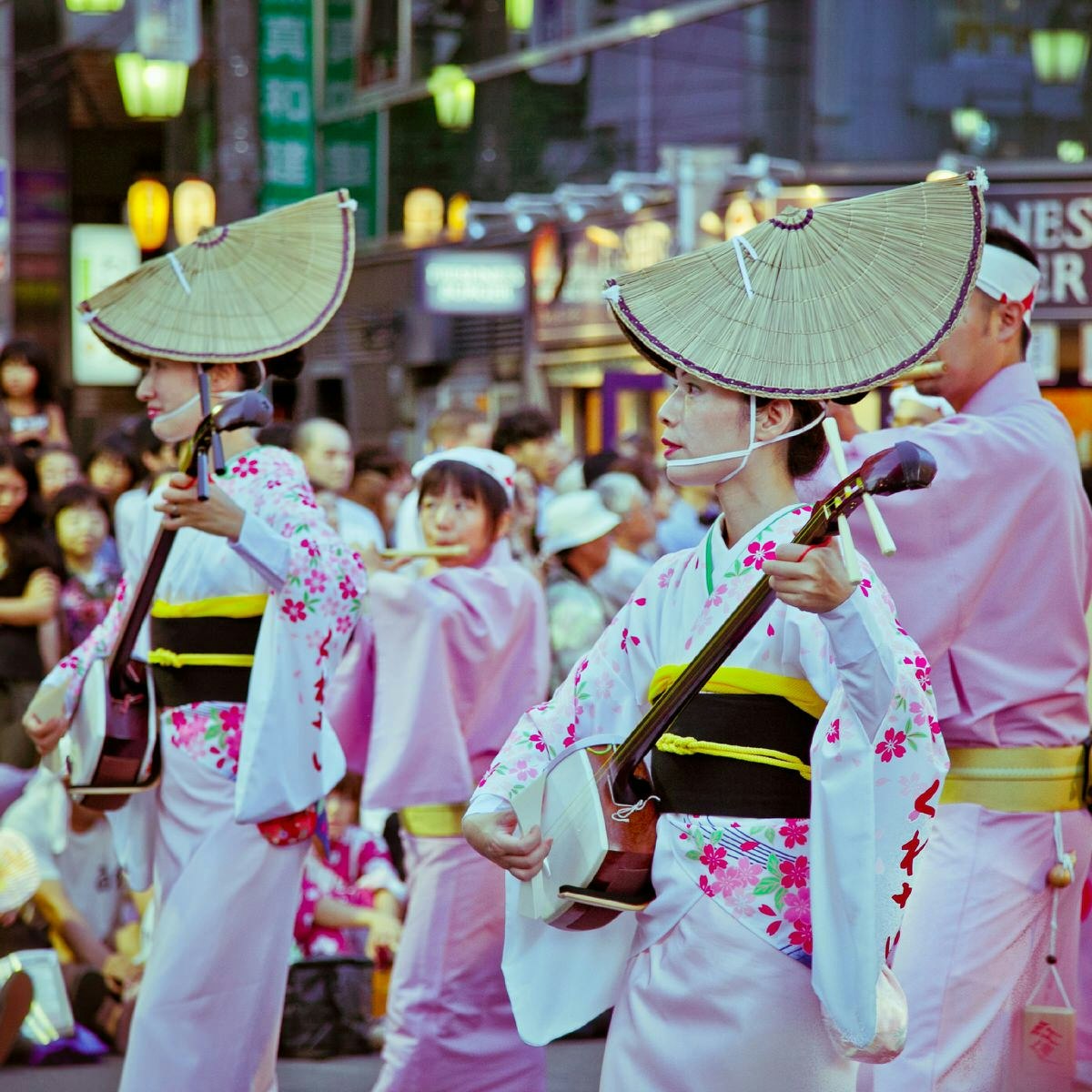 Tokyo summer - Performers dressed in pink and white parade as part of Koenji's Awa Odori festival
