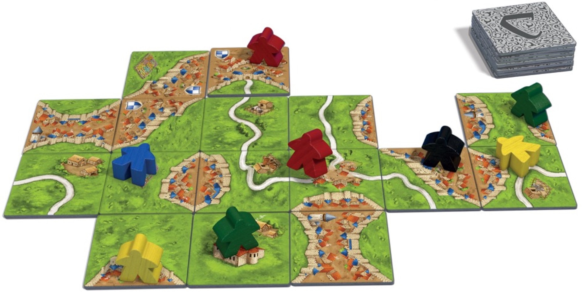 The board game Carcassonne is laid out on a white background