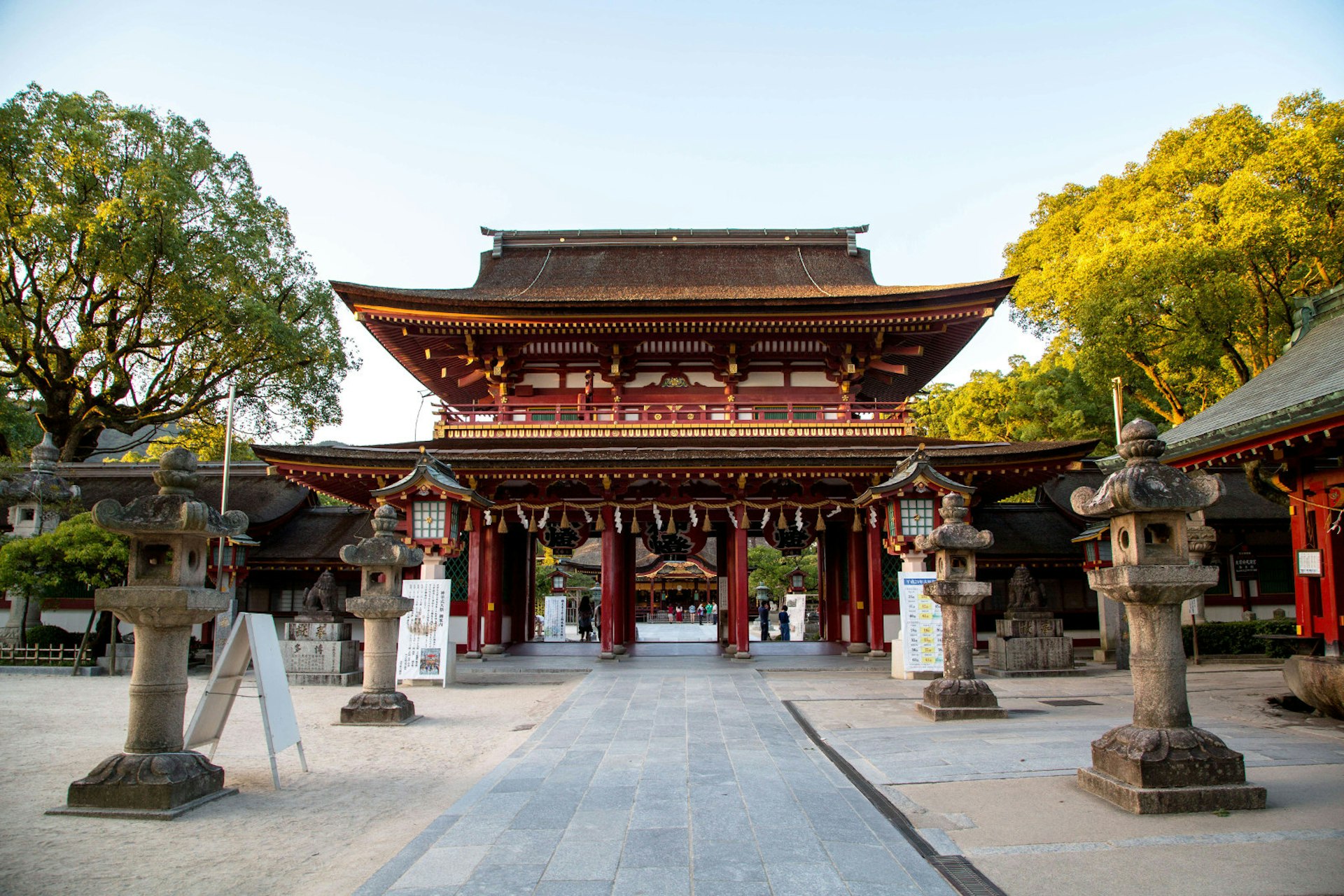 A Sacred pathway decorated with stone lanterns leads to the main gate of Dazaifu Tenmangu © Zhang Peng / LightRocket via Getty Images