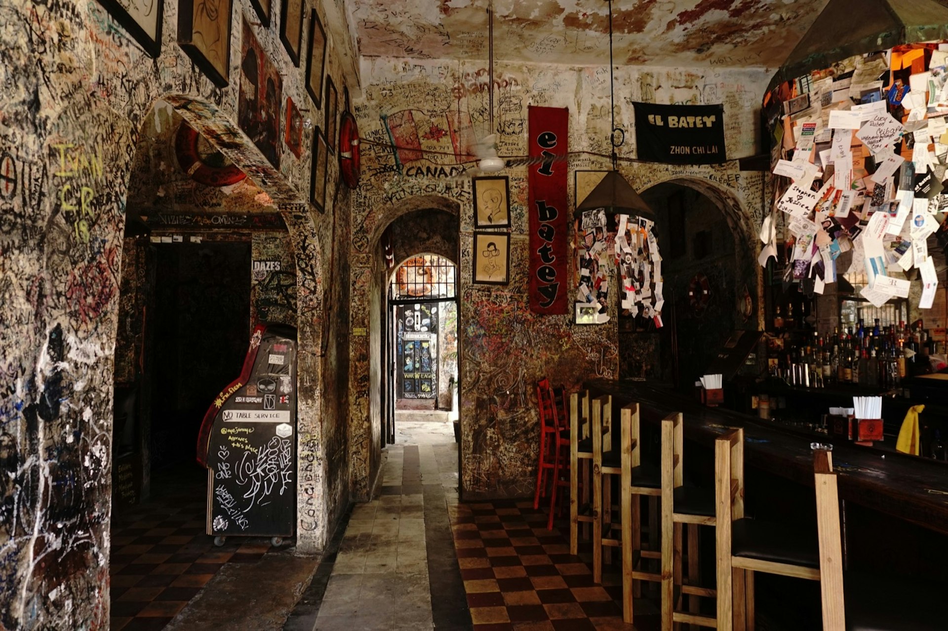 Graffiti and faded posters cover the walls of El Batey in San Juan, Puerto Rico; a classic venue for San Juan nightlife 