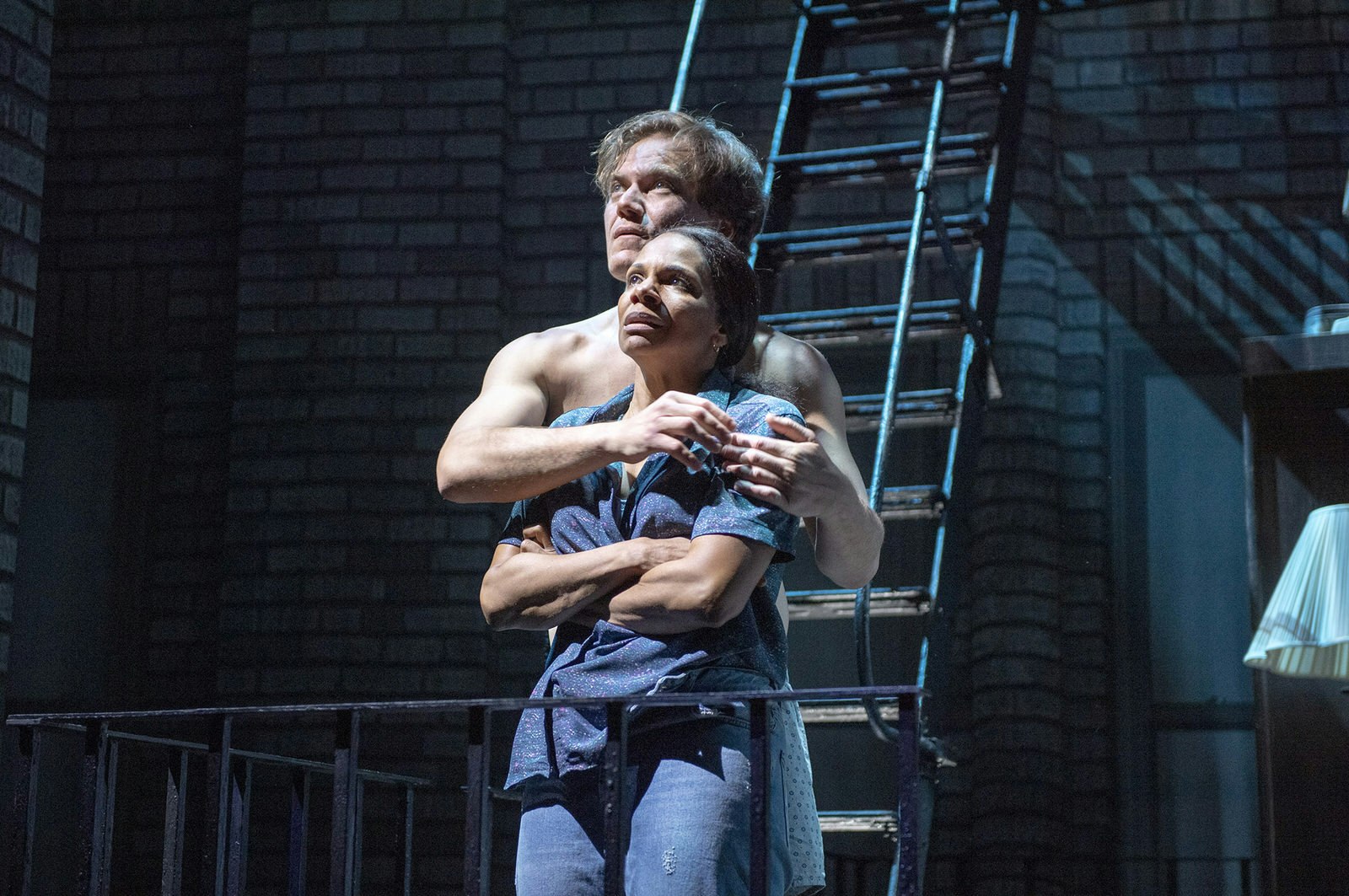Celebrities West End Broadway - Audra McDonald and Michael Shannon star in Frankie and Johnny in the Clair de Lune at the Broadhurst Theatre, New York. The actors embrace on stage in front of a staircase © Deen van Meer