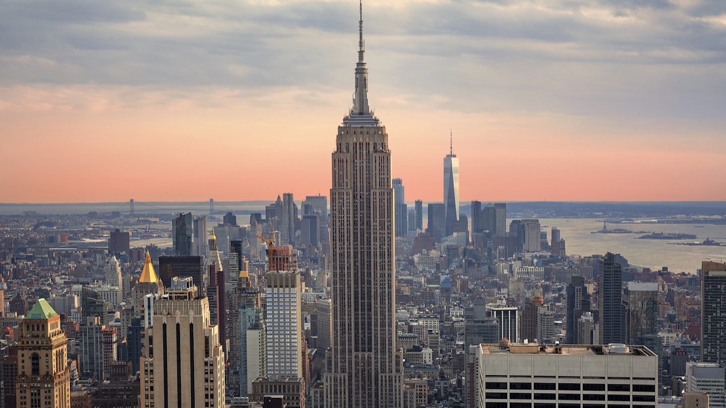 The Empire State Building at sunset is a beautiful site, but it is a New York City landscape you can skip. Instead watch the sunset from another New York City building
