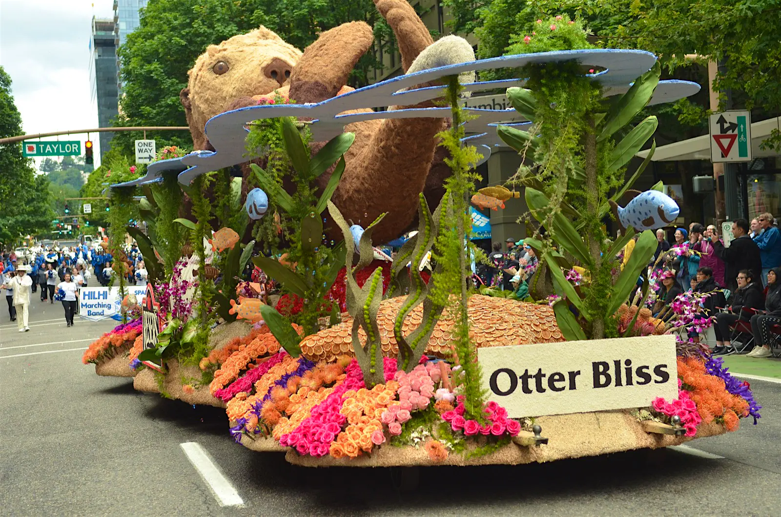 Features - Grand-Floral-Parade-Vern-355-8d917cbe73b0 A float moves down a street in Portland, depicting an otter on its back