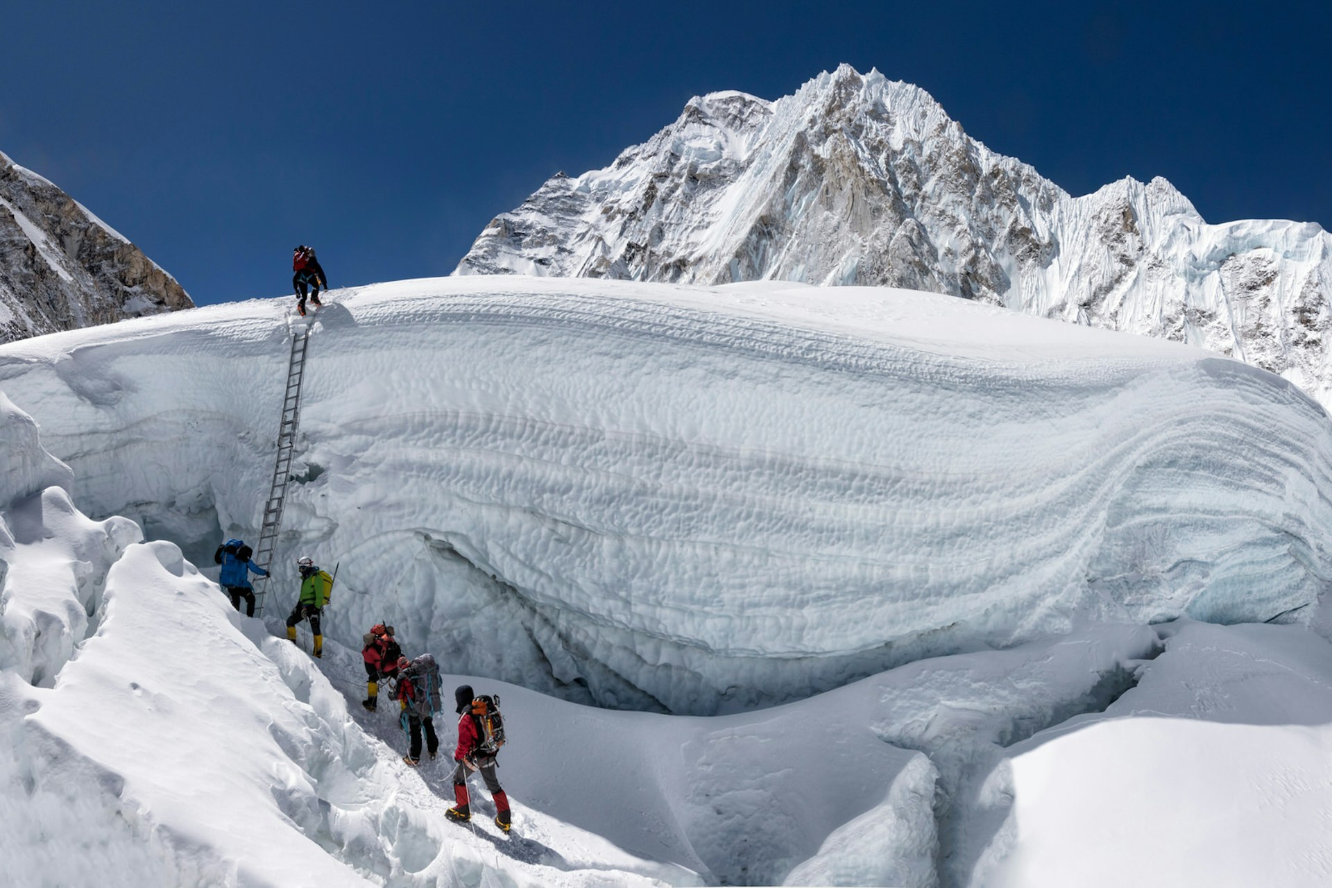 Climbers on the Khumbu Icefall above Everest Base Camp