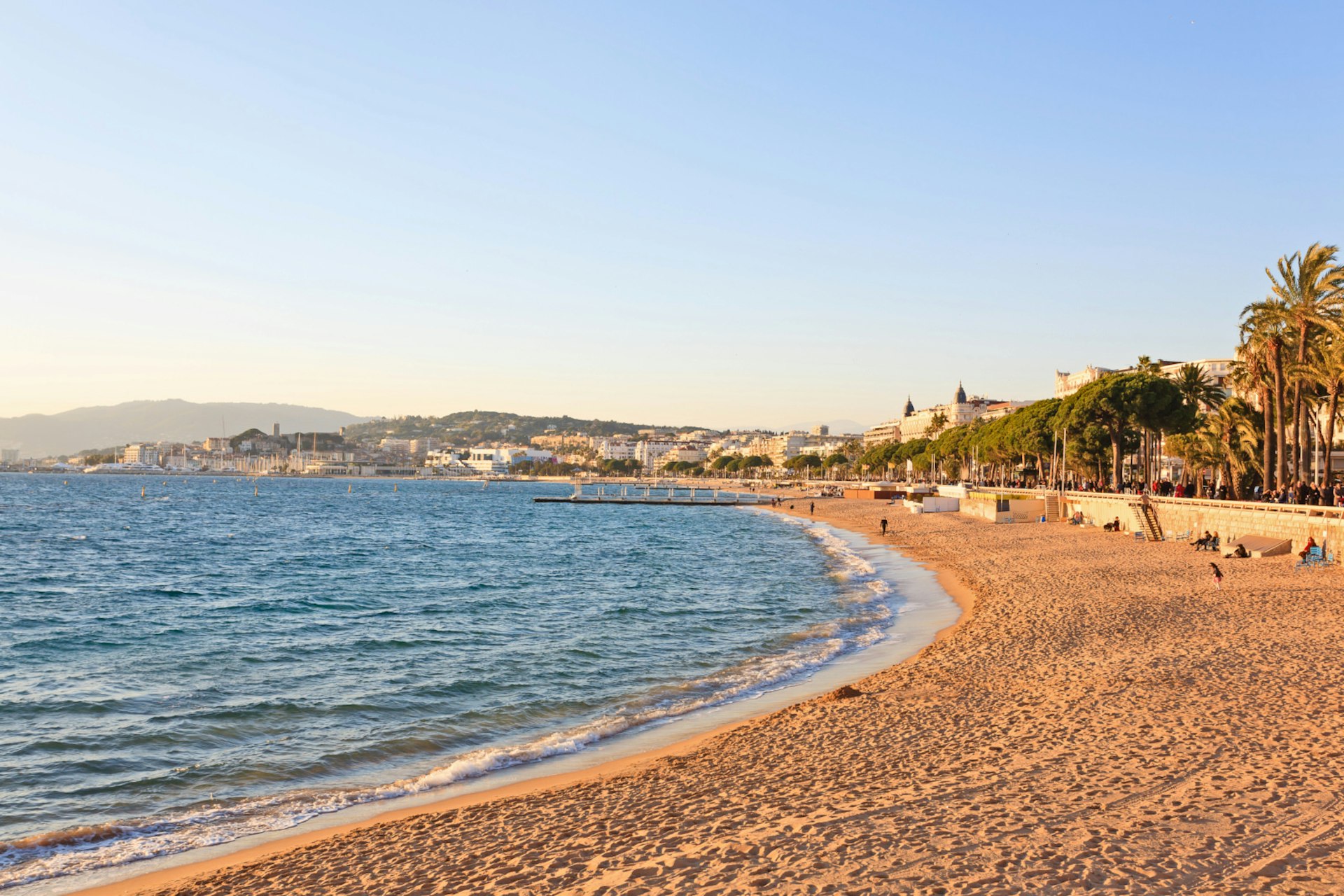 The sun sets over Cannes' famed La Croisette beach in France