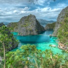 Palawan travel - Coron Island in northern Palawan viewd from a height. The green island rises sharply out of jewel-blue waters © Kevin Boutwell/500px