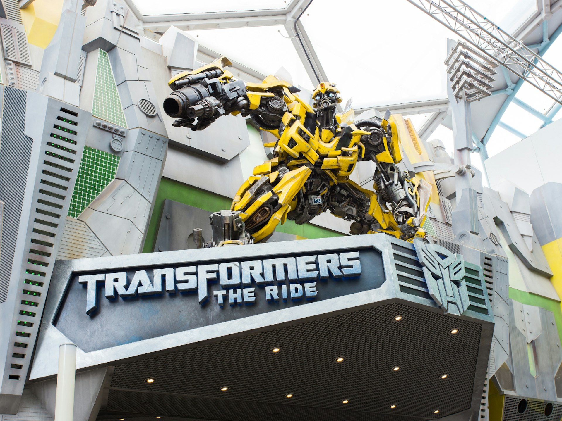Disney alternatives - The dynamic 3D Transformers Ride at Universal Studios, Singapore. The character Bumblebee crouches above the entrance to the ride