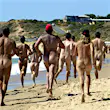 Unclad athletes compete in the marathon event during the Nude Olympics on Maslin Beach near Adelaide