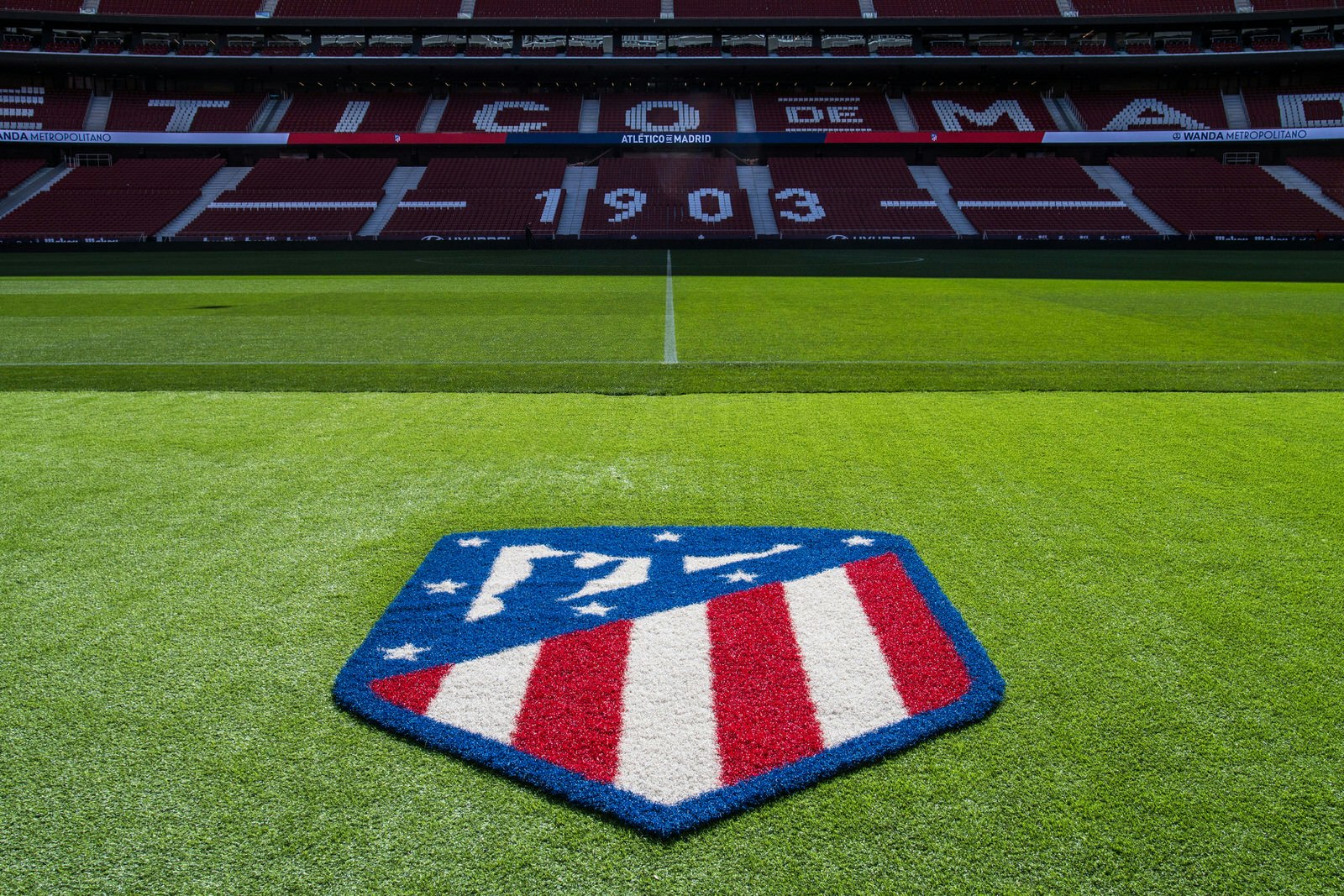 The Atlético Madrid badge on the pitch in the Wanda Metropolitano stadium, which is hosting the Champions League Final