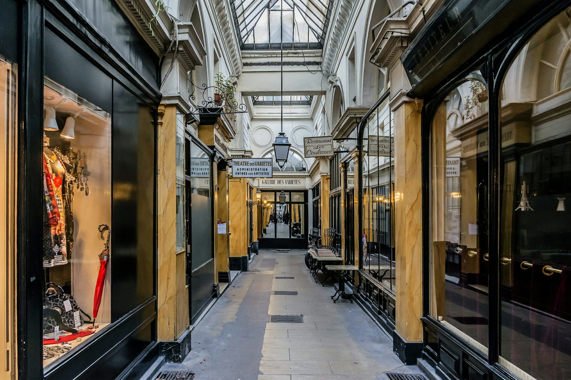 Narrow walkway through Passage des Panoramas, the oldest covered passageway in Paris