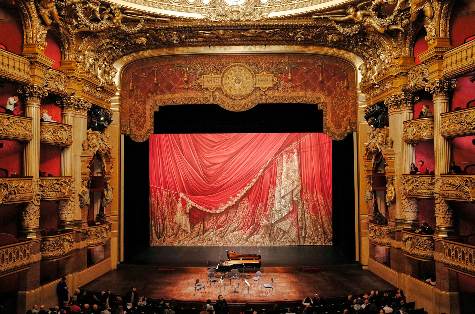 The golden-gilded interior of the Palais Garnier opera house in Paris, France