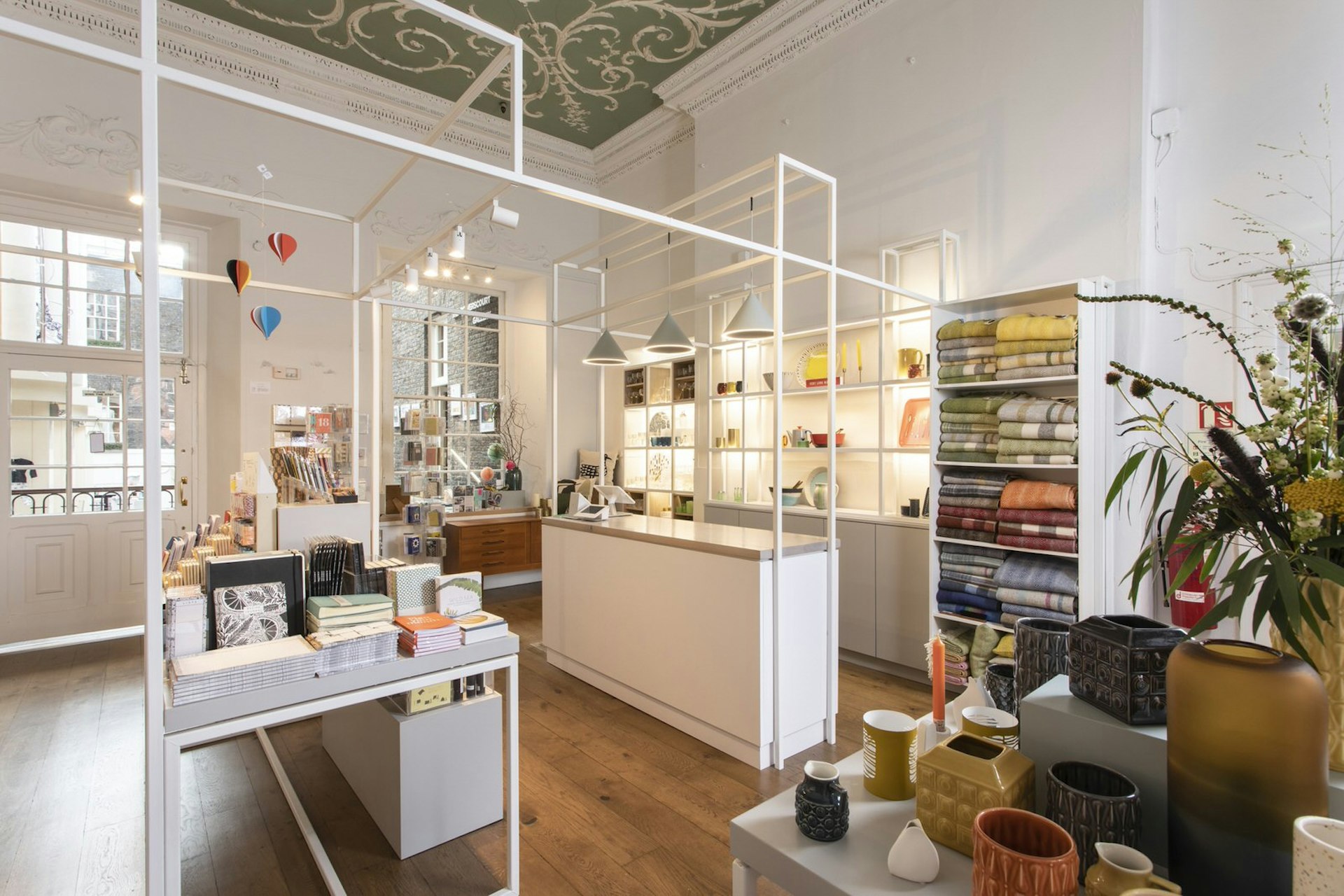 Dublin independent shops - Article's interior with white walls, shelves and tables. The surfaces are full of colourful homewares