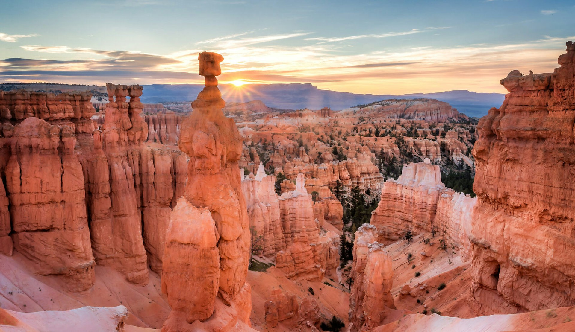 Red rock formations at dusk in a canyon.