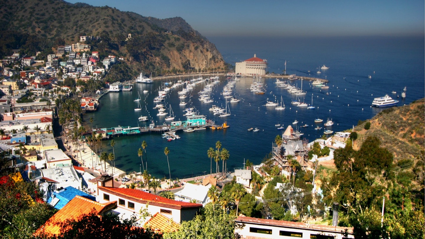 View of Avalon village, Catalina island, about 1 hour away from the California coast at Long Beach by catamaran. Midday view, the Los Angeles smog is visible along the horizon.