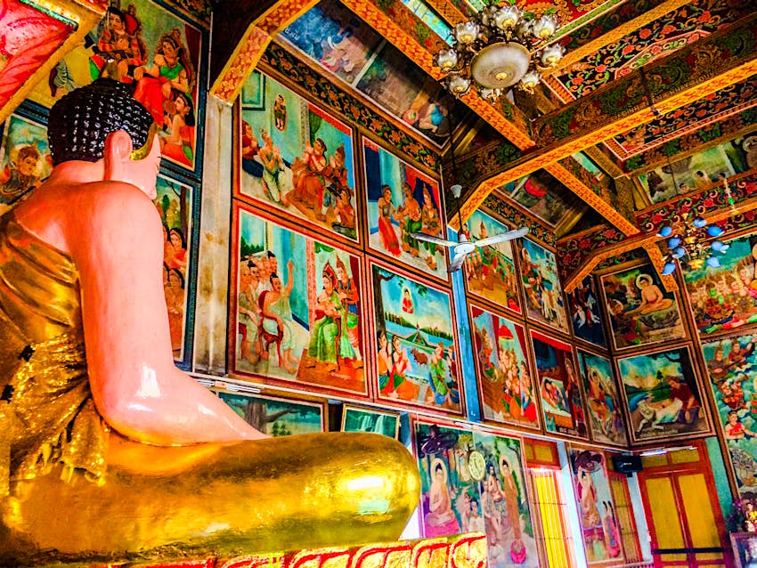A golden Buddha statue inside the colourful Chantaransey Pagoda, Ho Chi Minh City