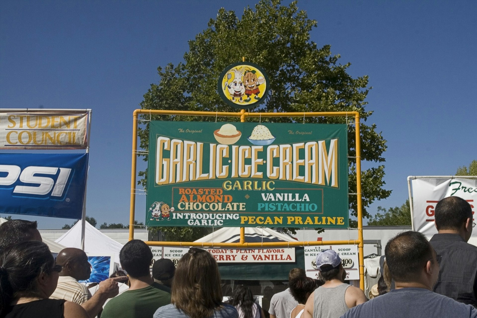 Sign over a crowd of people at the Gilroy Garlic Festival reads Garlic Ice Cream at one of California's best summer food and drink festivals