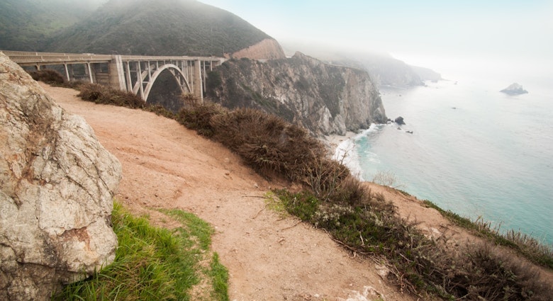The Bixby Bridge with some fog and the ocean is a filming location in Big Little Lies