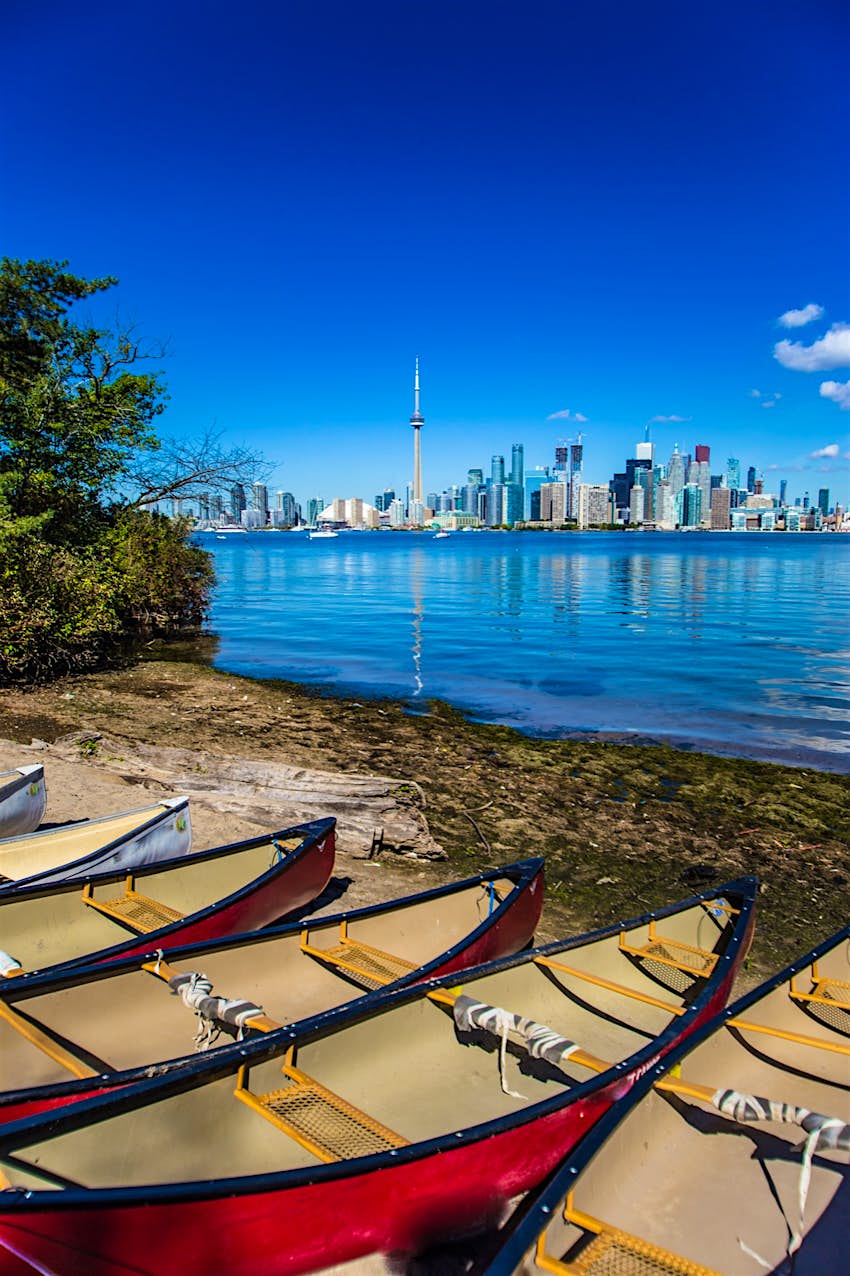 City of Toronto View from Toronto Island Park, with canoes in the foreground and the skyline behind