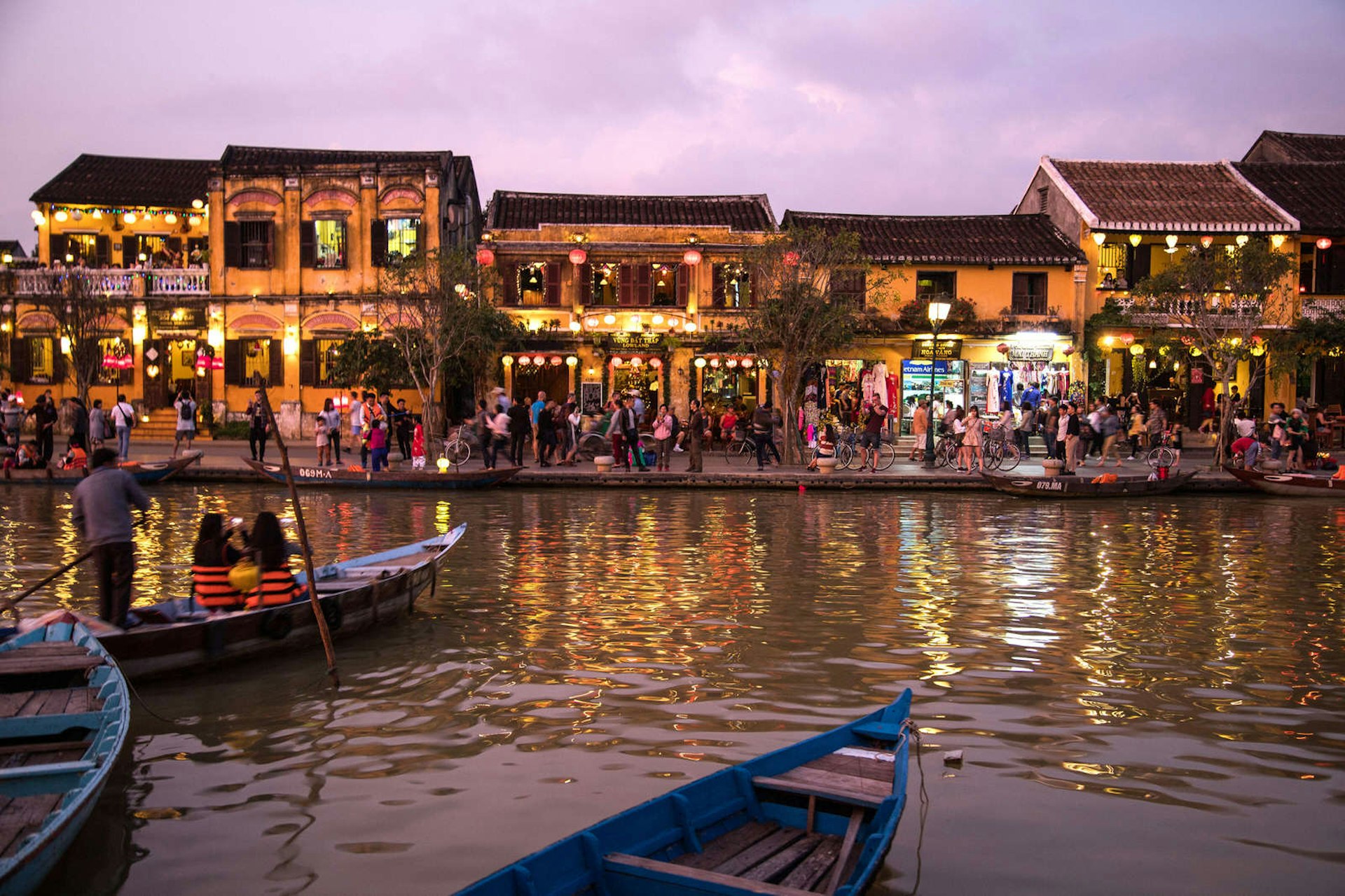 The Old Town of Hoi An viewed at dusk as lights twinkle off the river