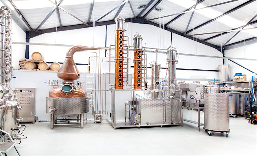 Cape Town gin - A white room, framed with a lattice of charcoal grey girders, is full of stainless stell and polised copper distillery equipment; it resembles a sci-fi lab of some sort