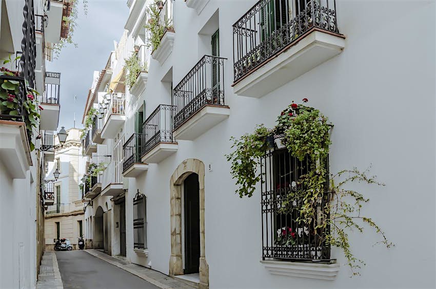 White houses in an alley in Sitges, Spain.