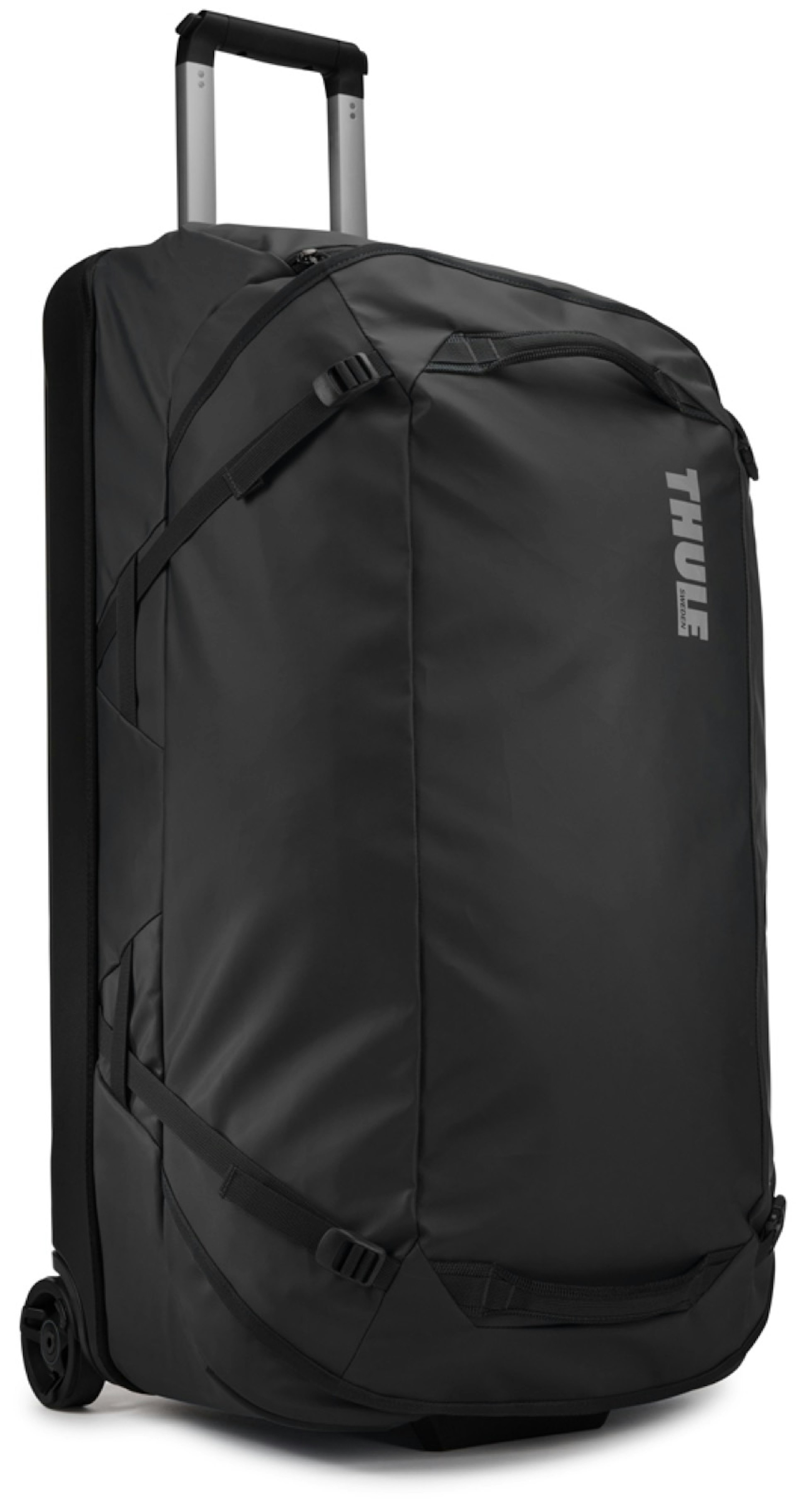 a black duffle bag with the word THULE printed in grey across the front has wheels and a telescoping handle