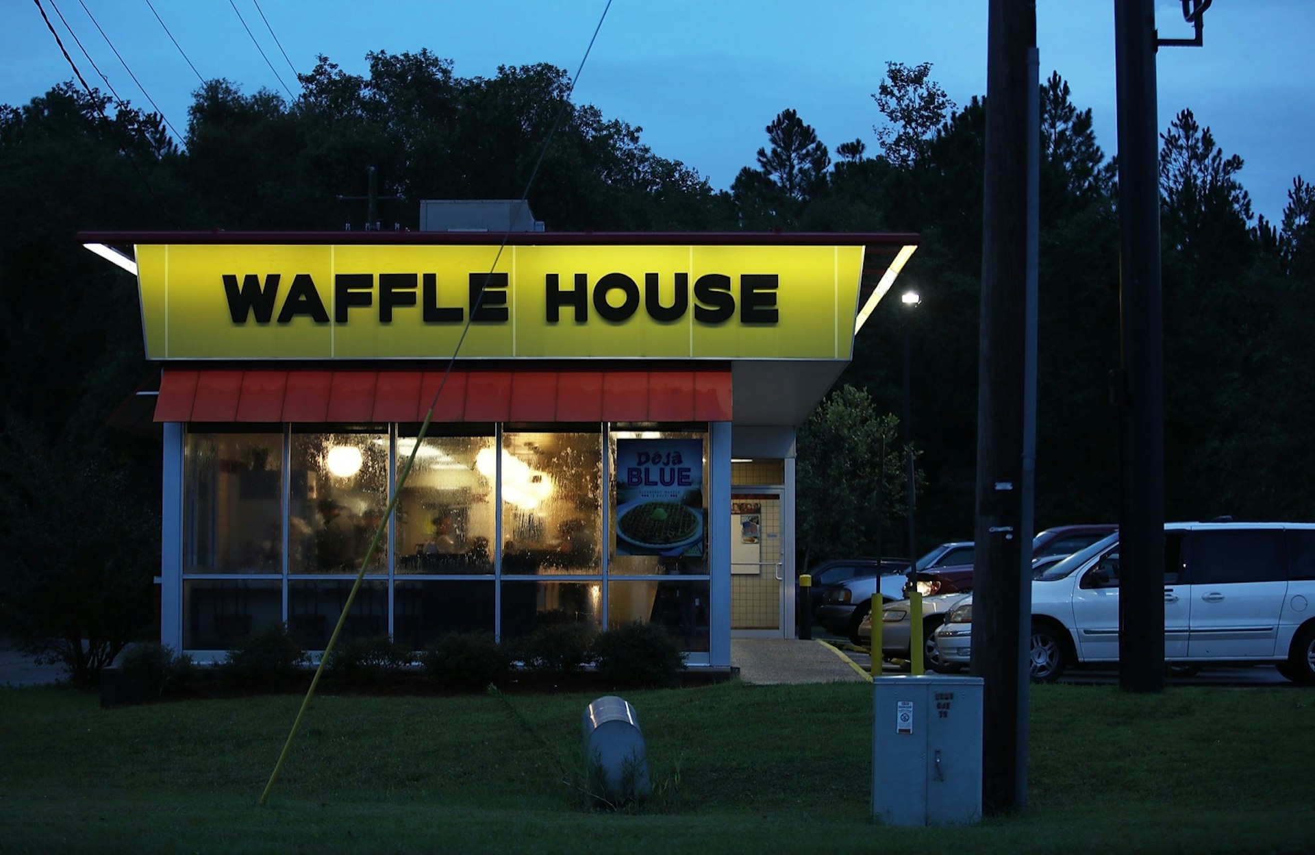 A waffle house on the Gulf Coast is open at twilight