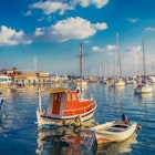 Features - Sailboats Moored At Harbor Against Sky