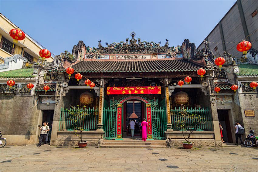 Ornate facade of the Thien Hau Temple, with Chinese lanterns strung in front, Ho Chi Minh City