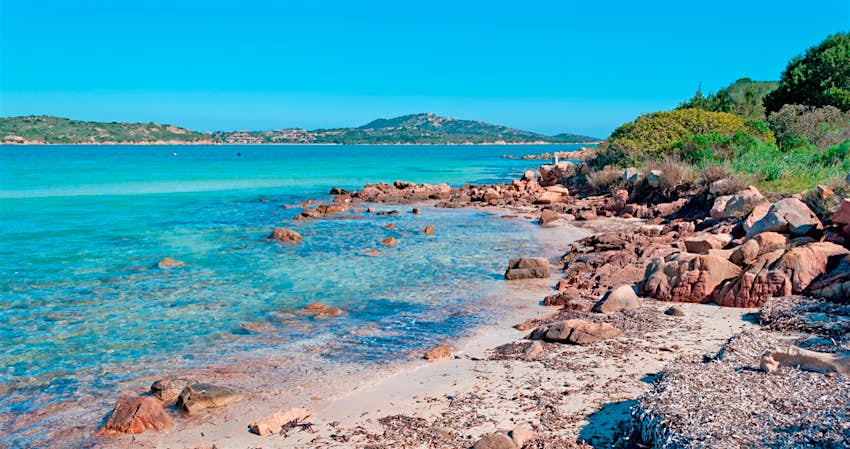 Azure waters near a rocky shore; best things to do in Sardinia