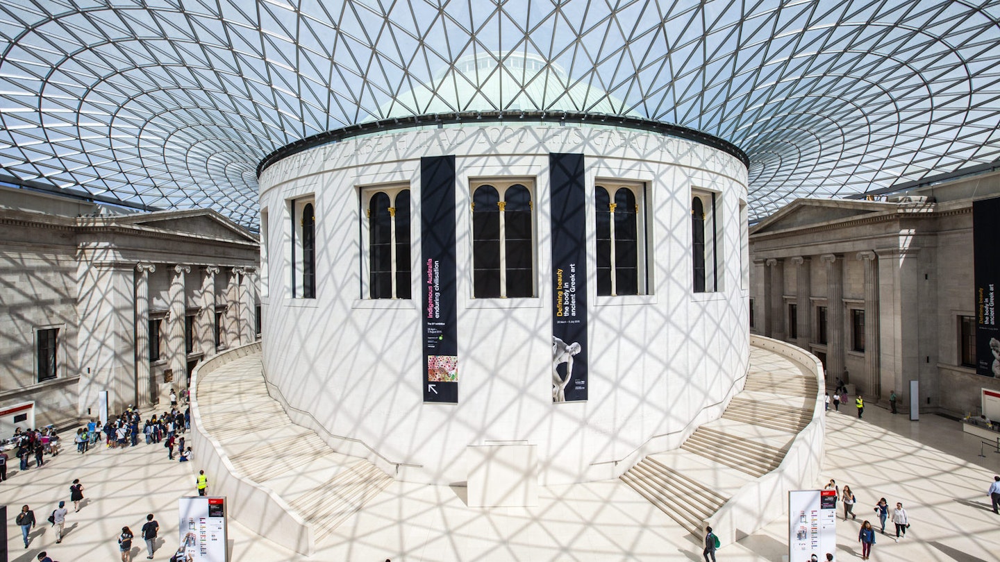 The central hall of the British Museum is a large round white space flooded with light from the glass ceiling