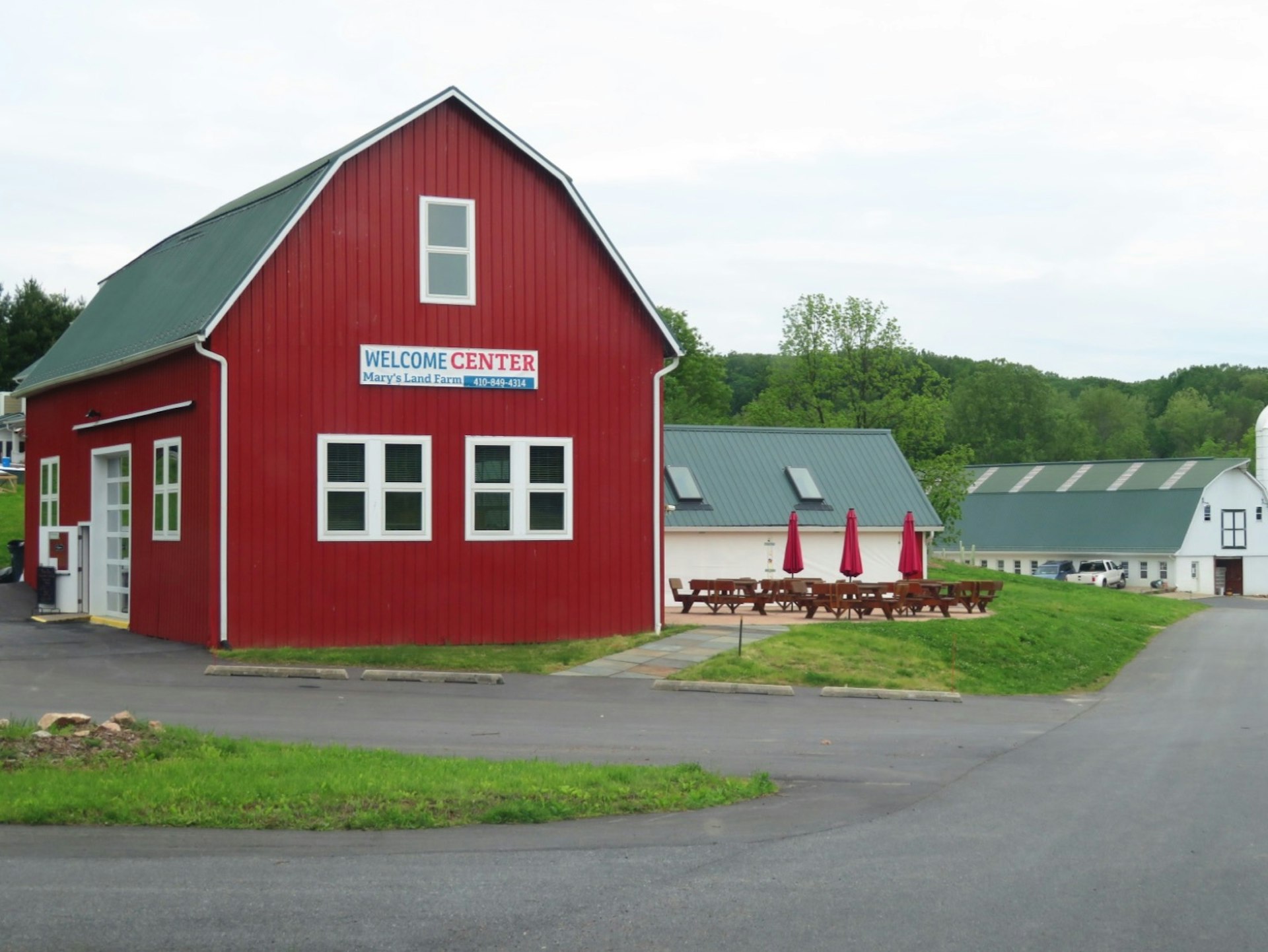 A large red barn surrounded by other buildings in Howard County, Maryland