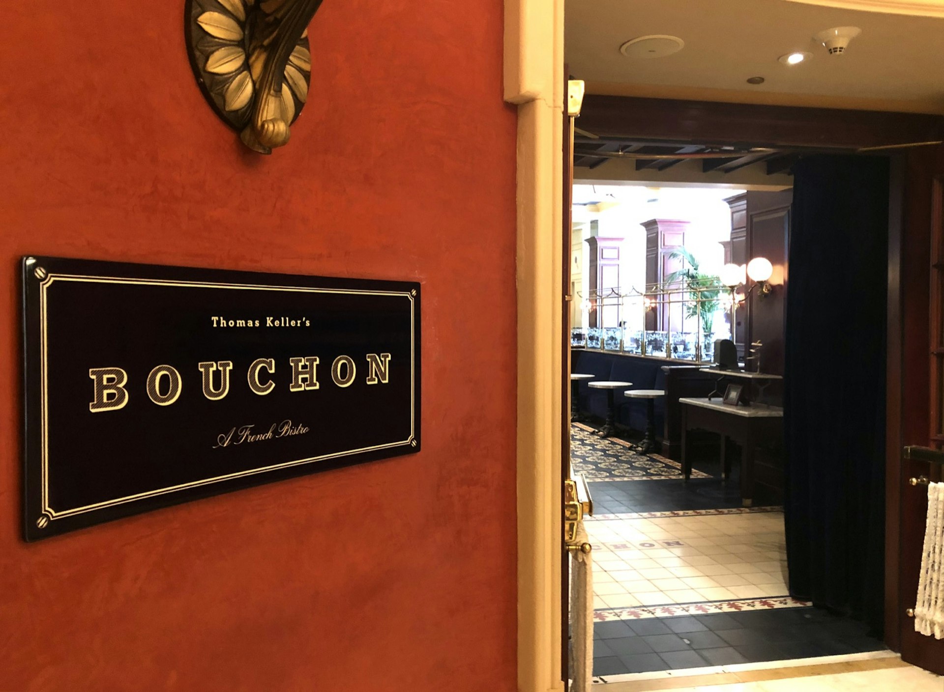 A small black sign marks the entrance to Bouchon, a celebrity chef restaurant in Las Vegas