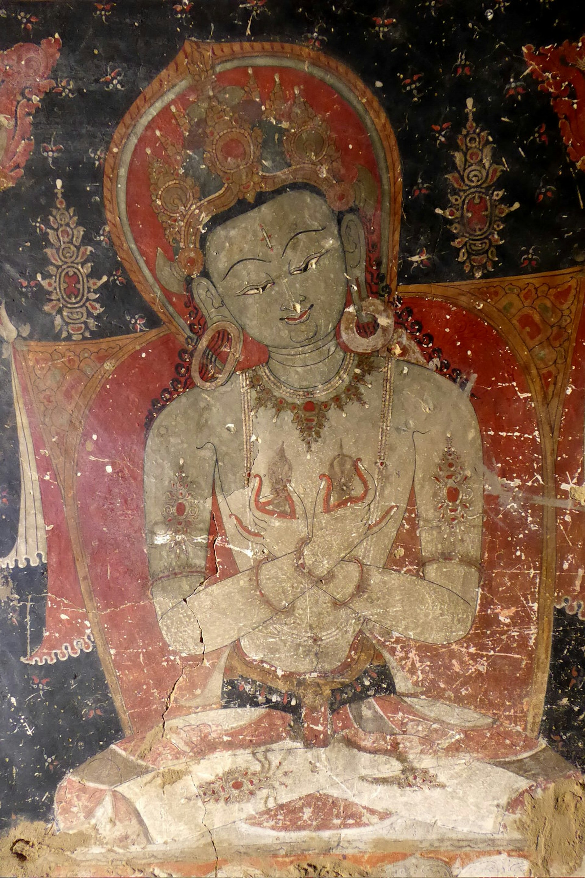 A time-scarred mural showing the clear influence of Tibet