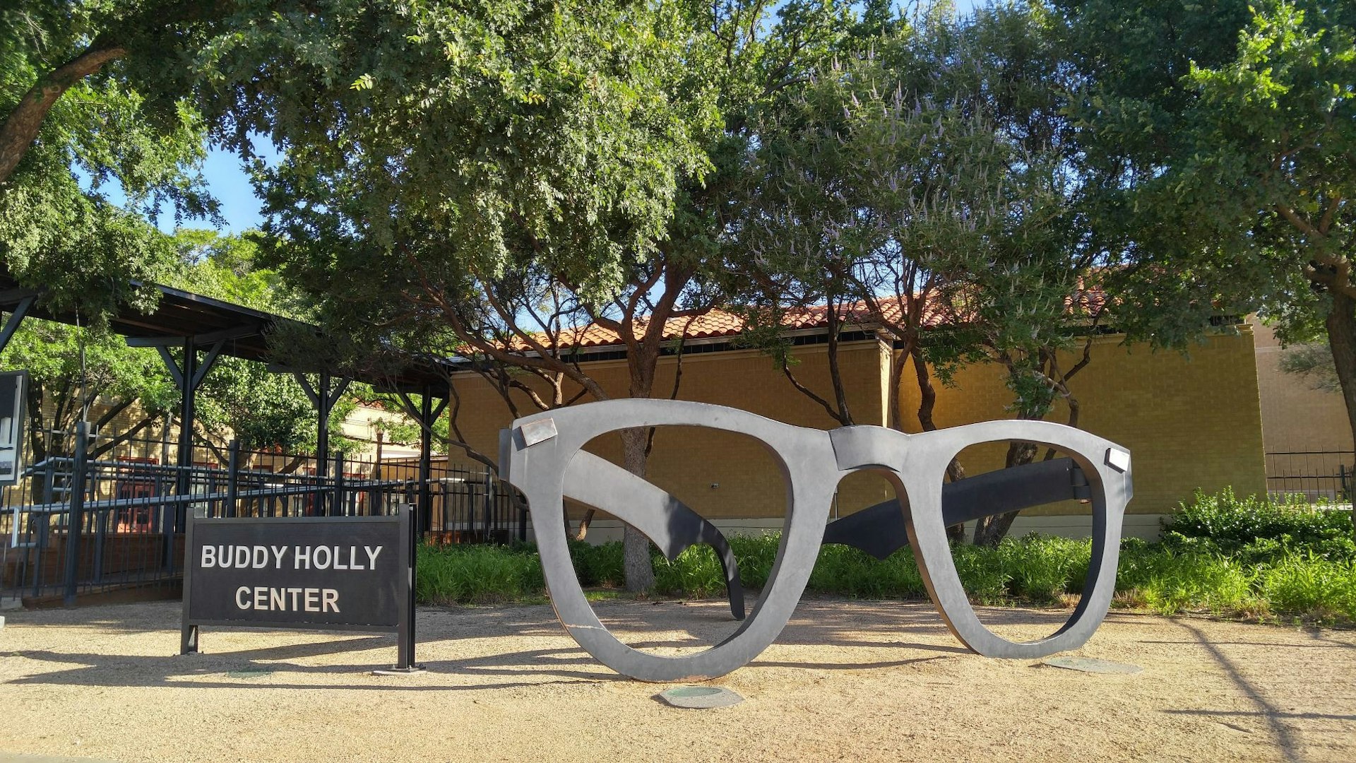 A large pair of Buddy Holly's signature sunglasses sit outside the Buddy Holly Center. USA museums for music lovers