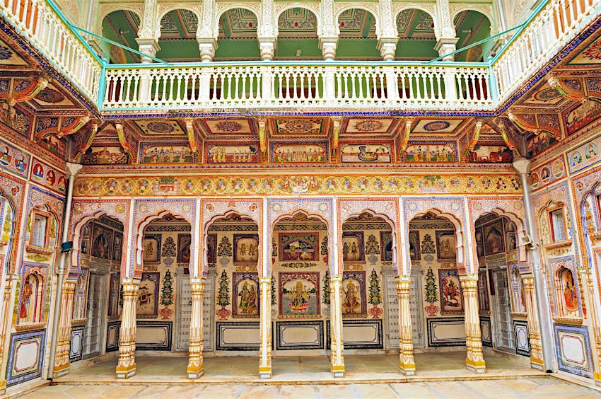 A fresco on a haveli wall in Nawalgarh, which is adorned with colourful patterns and images from floor to ceiling